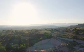 Stock Video Flying Over A Warm And Arid Landscape At Sunrise For PC