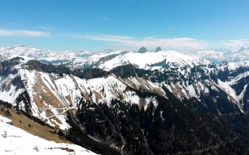 Stock Video Flying Over A Snowy Mountain Peak For PC
