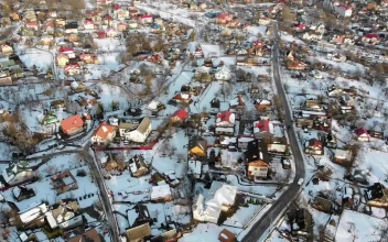 Stock Video Flying Over A Small Village In The Winter For PC