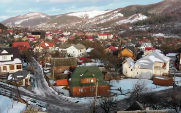 Stock Video Flying Over A Small Town During The Winter For PC