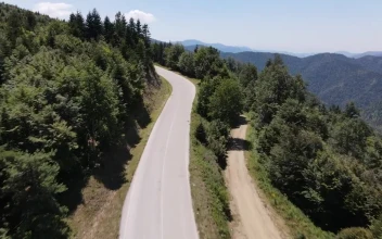 Stock Video Flying Over A Freeway In The Mountains For PC