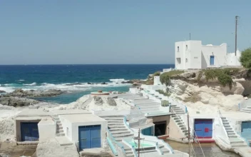 Stock Video Flying Off The Coast Of A Fishing Village In Greece For PC