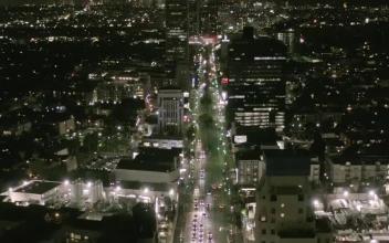 Stock Video Flying Down A Main Avenue In Los Angeles At Night For PC