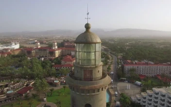 Stock Video Flying Away From An Old Lighthouse For PC