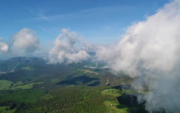 Stock Video Flying At Cloud Level With The Mountains Below For PC