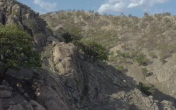 Stock Video Fly Over A Mountain Range In An Arid Environment For PC