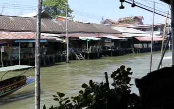Stock Video Floating Market With A Speeding Boat Passing By For PC