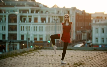Stock Video Flexible Ballet Dancer Does A Complicated Position For PC