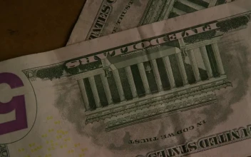 Stock Video Five Dollar Bills Pulling Into The Table For PC