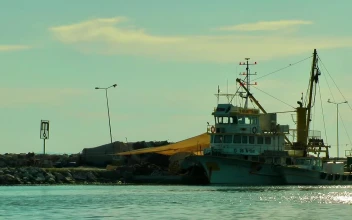 Stock Video Fishing Boat Anchored On The Coast For PC