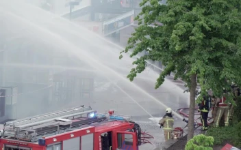 Stock Video Firefighters On The Street Shooting Water With Their Hoses For PC