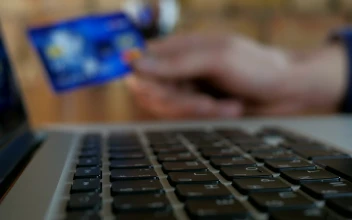 Stock Video Finger Typing And Unfocused Hand Holding Credit Card For PC
