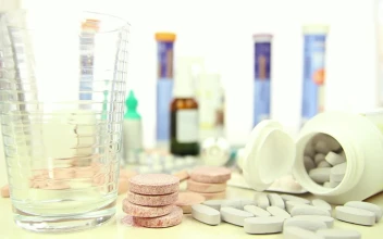 Stock Video Filling A Glass Surrounded By Many Drugs For PC