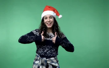 Stock Video Festive Girl Smiling And Showing A Thumbs Up For PC