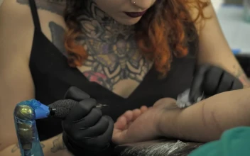 Stock Video Female Tattoo Artist Working For PC