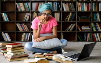 Stock Video Female Student In The Library For PC