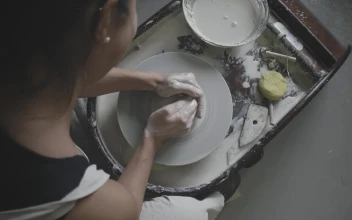 Stock Video Female Potter Works On Pottery Wheel For PC