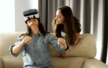 Stock Video Female Friends Playing Virtual Reality Video Games For PC