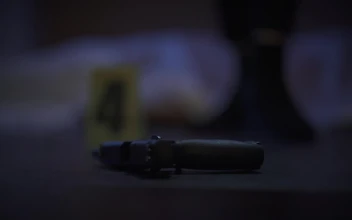 Stock Video Female Detective Analyzing A Gun At A Crime Scene For PC