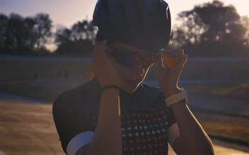 Stock Video Female Cyclist Putting On Sunglasses Before Training For PC