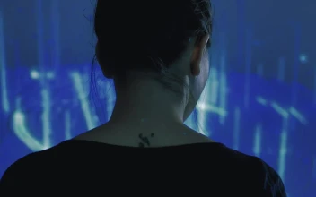 Stock Video Female Cyborg Watching To A Hologram For PC