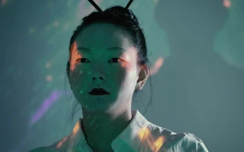 Stock Video Female Cyborg Raising Hand And Looking At The Camera For PC