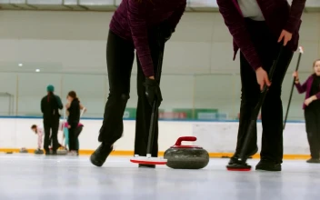 Stock Video Female Curling Players In A Shot Close To The Ice For PC