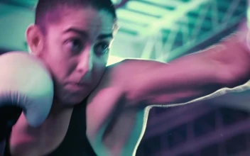Stock Video Female Boxer Punching A Boxing Bag For PC