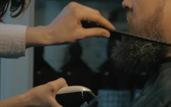 Stock Video Female Barber Trimming A Long Beard For PC