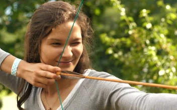 Stock Video Female Archer Shooting An Arrow For PC