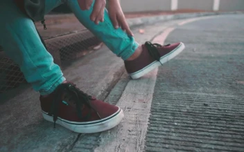 Stock Video Feet Of A Young Man With Red Tennis Shoes For PC