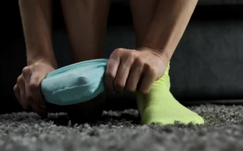 Stock Video Feet Of A Woman Putting On Different Colored Socks For PC