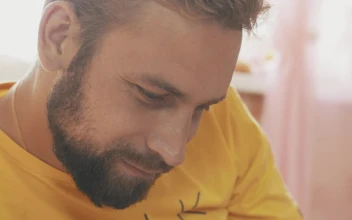 Stock Video Father With A Short Beard Next To His Baby For PC