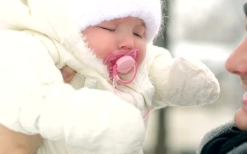 Stock Video Father Looking And Kissing His Baby In Winter For PC