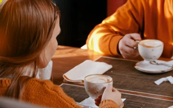 Stock Video Father Drinking Coffee With His Daughters For PC