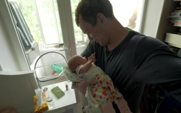 Stock Video Father Caring For His Newborn Baby For PC