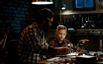 Stock Video Father And Son Repairing A Drone For PC