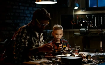 Stock Video Father And Son Repairing A Drone In The Garage For PC