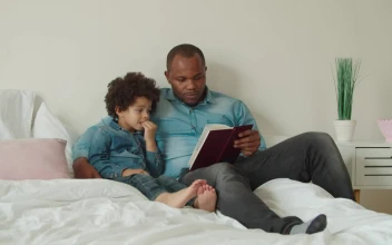 Stock Video Father And Son Reading A Book Together For PC