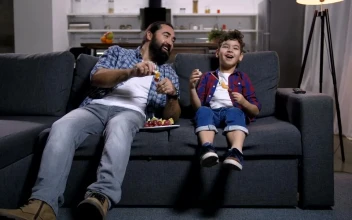 Stock Video Father And Son Laughing At The Tv For PC