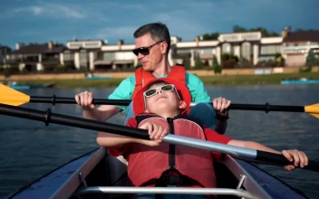 Stock Video Father And Son Doing Kayak In The Lake For PC