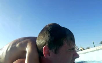 Stock Video Father And Son Diving In A Pool For PC