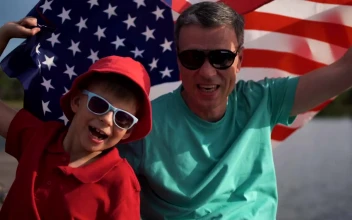 Stock Video Father And Son Celebrating With An American Flag For PC