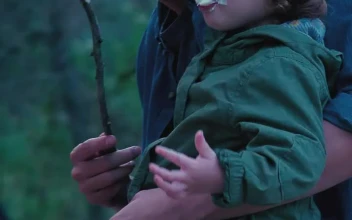 Stock Video Father And His Little Daughter Eating Marshmallows In Nature For PC