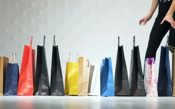 Stock Video Fashionable Women Pick Up Shopping Bags On White Background For PC