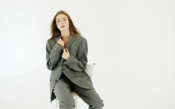 Stock Video Fashion Model Sits Posing With White Background For PC