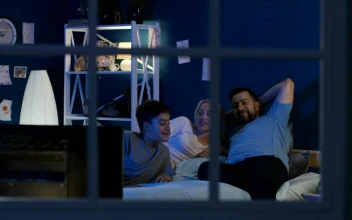 Stock Video Family Watching Tv In The Bedroom For PC