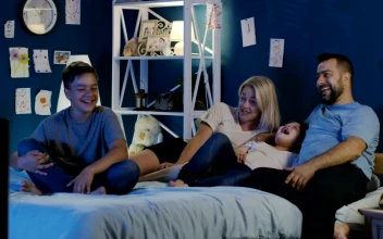Stock Video Family Watching The Tv In The Bedroom For PC