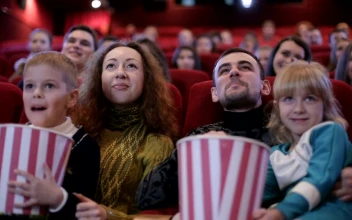 Stock Video Family Watching A Movie At The Cinema For PC