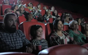 Stock Video Family Watching A Film Together In A Cinema For PC